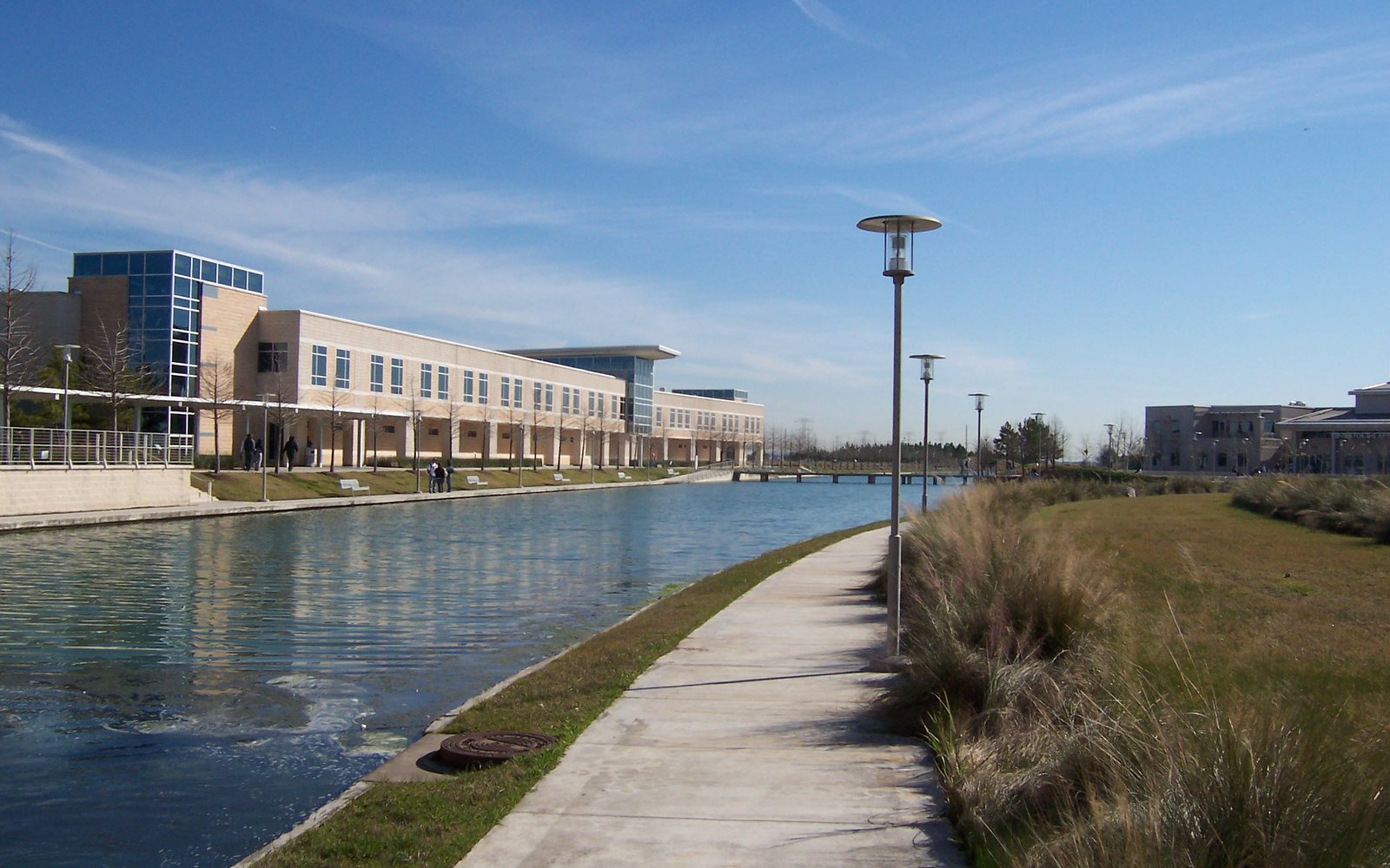 A building at Lone Star College-CyFair beside a pond