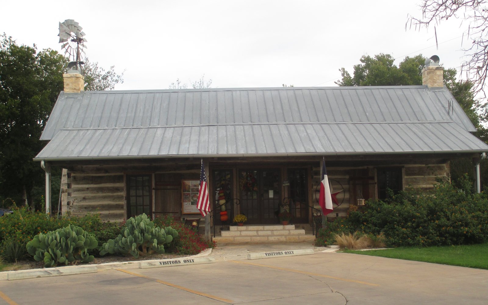 A log building with a metal roof in Salado