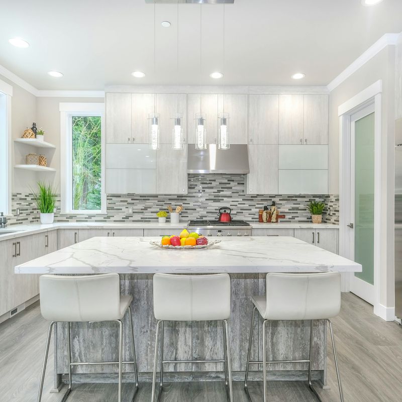 A white kitchen with an island